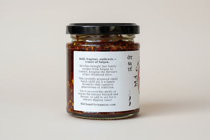 Side of Má Châu's Chilli Oil jar (handmade in Walthamstow, E17) providing information about its heritage: Bold, fragrant, authentic - a taste of Saigon.